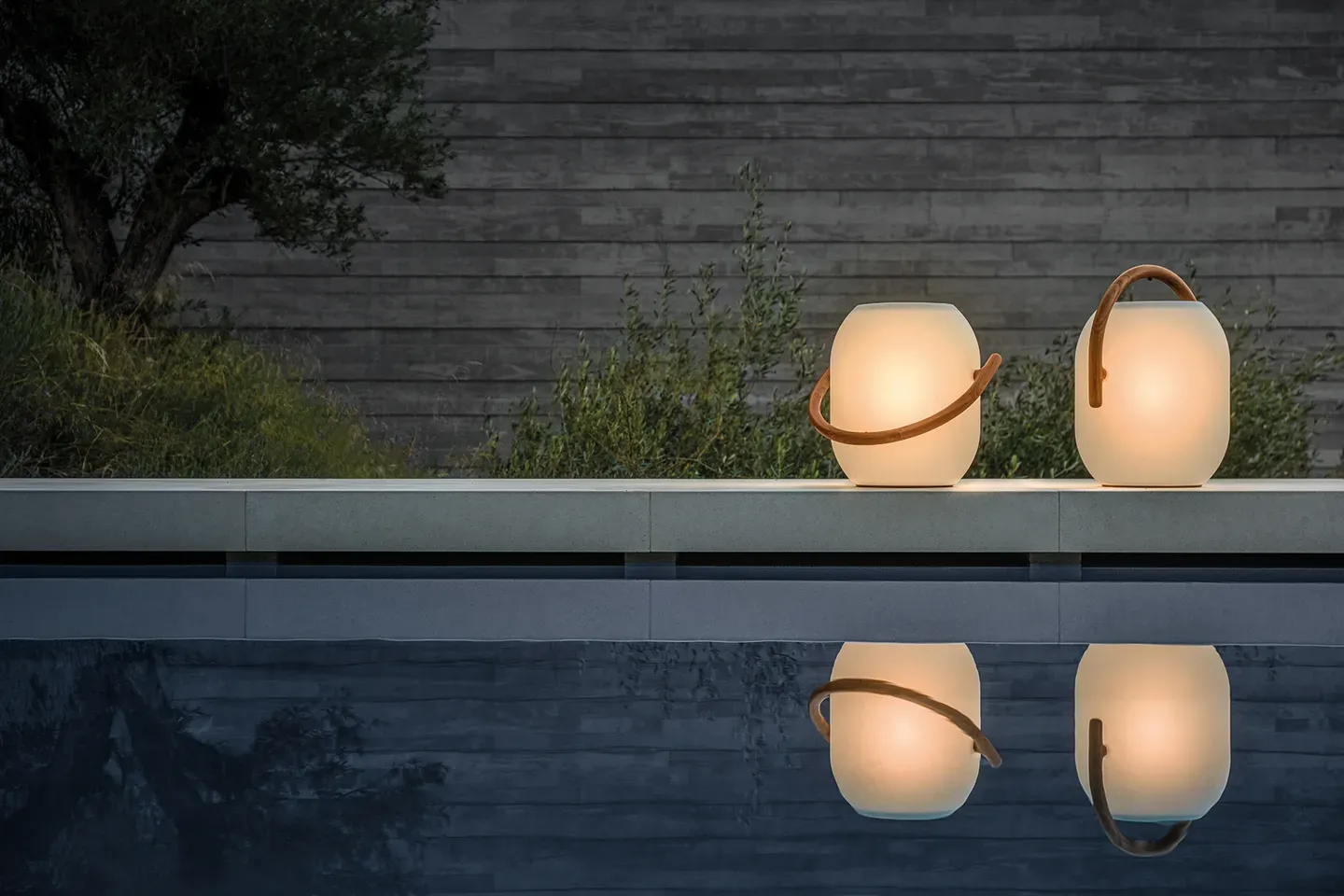 two ambient cocoon lanterns poolside close up product shot