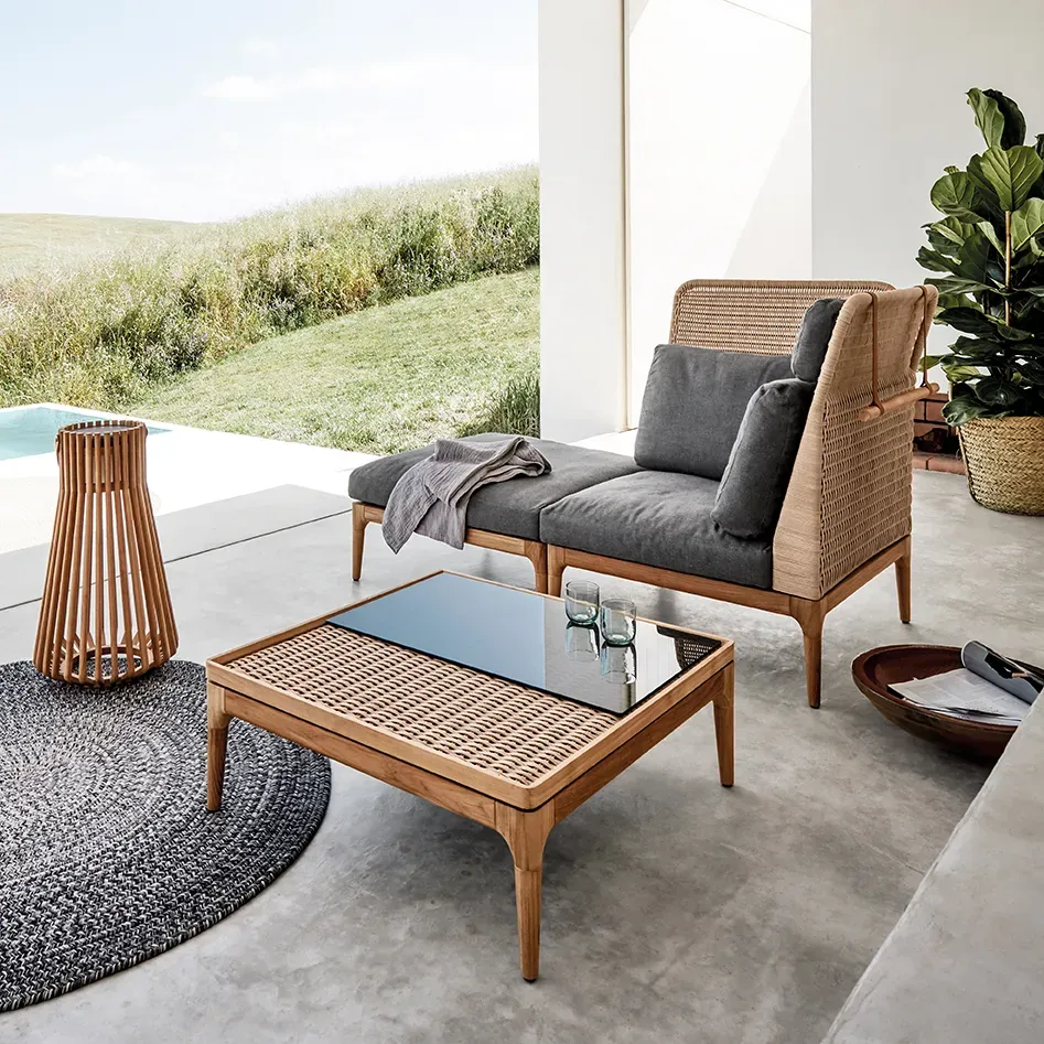 lima corner unit and lima ottoman with lima coffee table deco rug and two ambient ray lanterns poolside in a rural setting